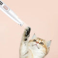 ForKumi professional pet grooming clippers with white design near playful cat paw