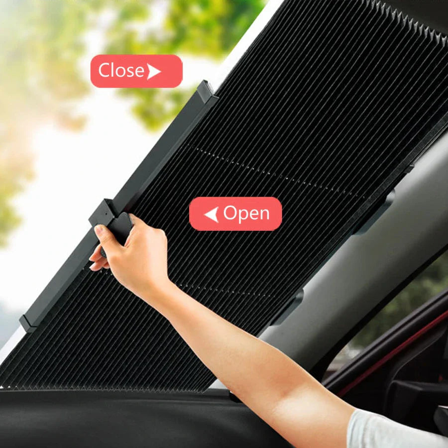 ForKumi retractable car sunshade being pulled open on a vehicle window to block sunlight