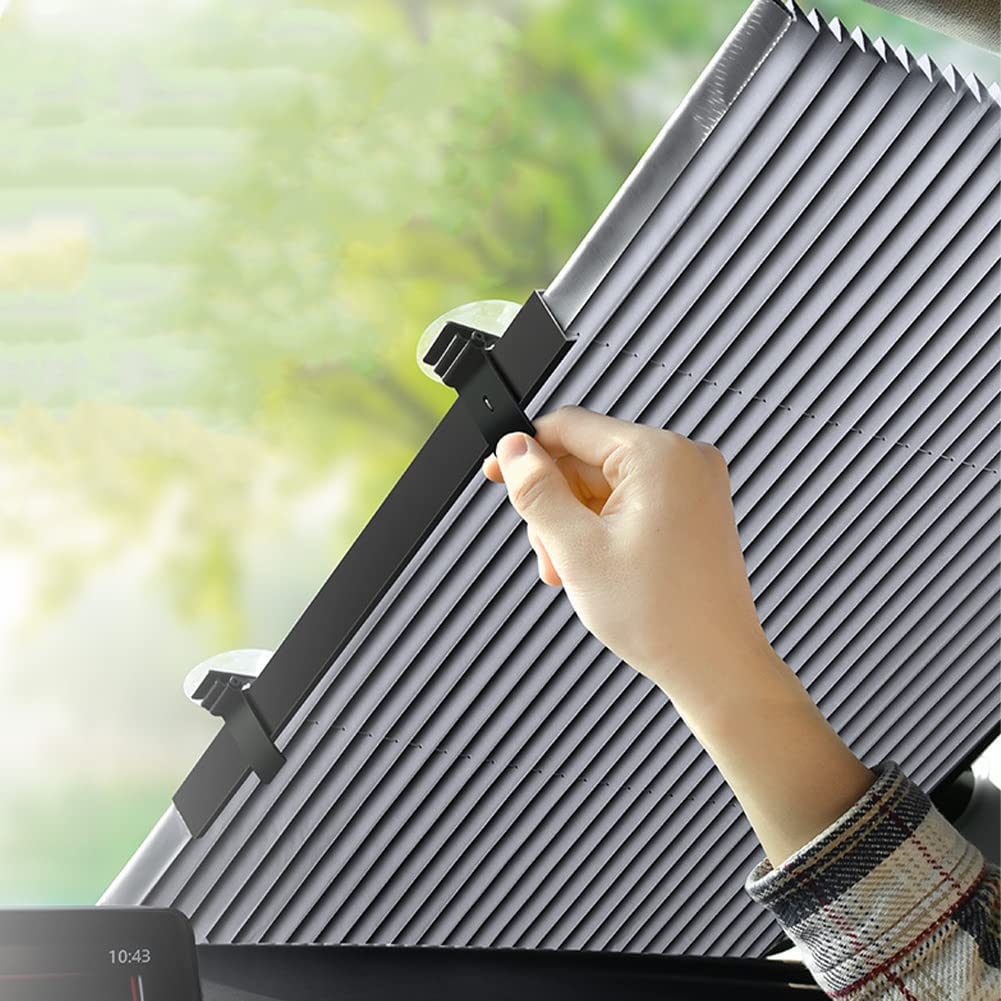 ForKumi retractable car sunshade being adjusted inside a vehicle to block sunlight