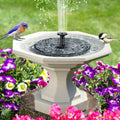 ForKumi solar fountain outdoor garden with birds perched on the edge surrounded by colorful flowers