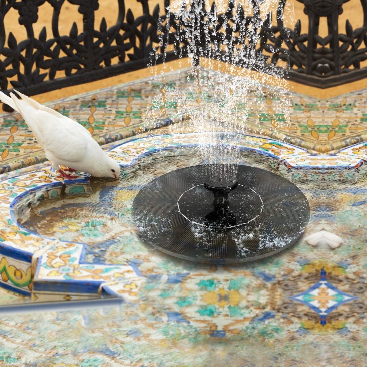 ForKumi solar fountain outdoor garden with decorative tile basin and water spray surrounded by black iron fence
