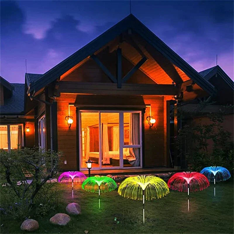 ForKumi solar palm lights outdoor in various colors lighting up backyard garden at night