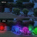 ForKumi solar powered landscape lighting illuminating garden bushes with colorful red blue purple and green lights at night