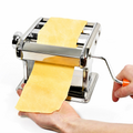 ForKumi stainless steel pasta maker with hand crank rolling out fresh pasta dough sheet