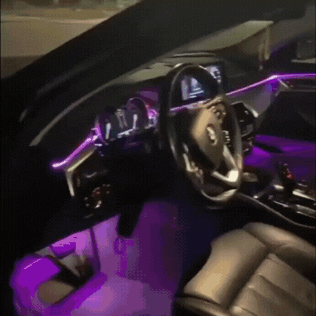6M RGB car interior LED strip installed around dashboard and footwell lighting in a black car