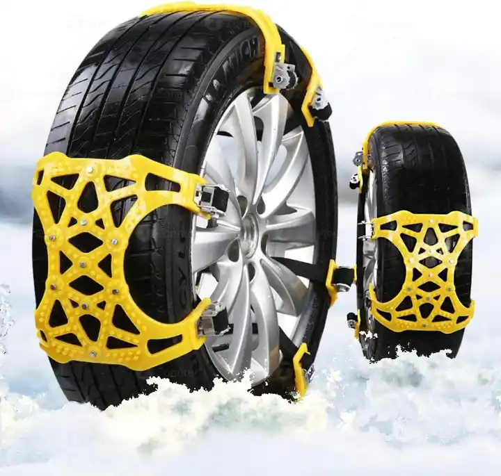 ForKumi universal snow chains for tires in yellow installed on car tires on snowy ground