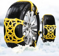 ForKumi universal snow chains for tires in yellow installed on car tires on snowy ground