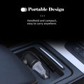 ForKumi portable and handheld USB car vacuum cleaner placed in vehicle center console for easy use