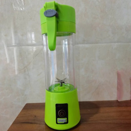 ForKumi green USB portable blender with clear container and power button on wooden surface