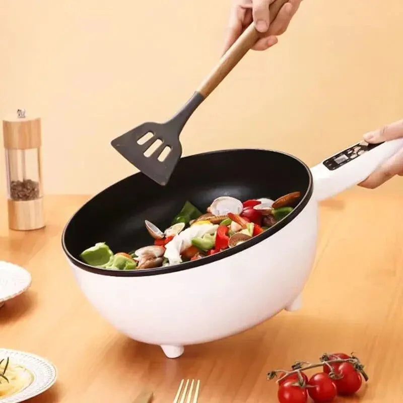 ForKumi 6-in-1 smart cooker white electric pot with vegetables being stirred on wooden table