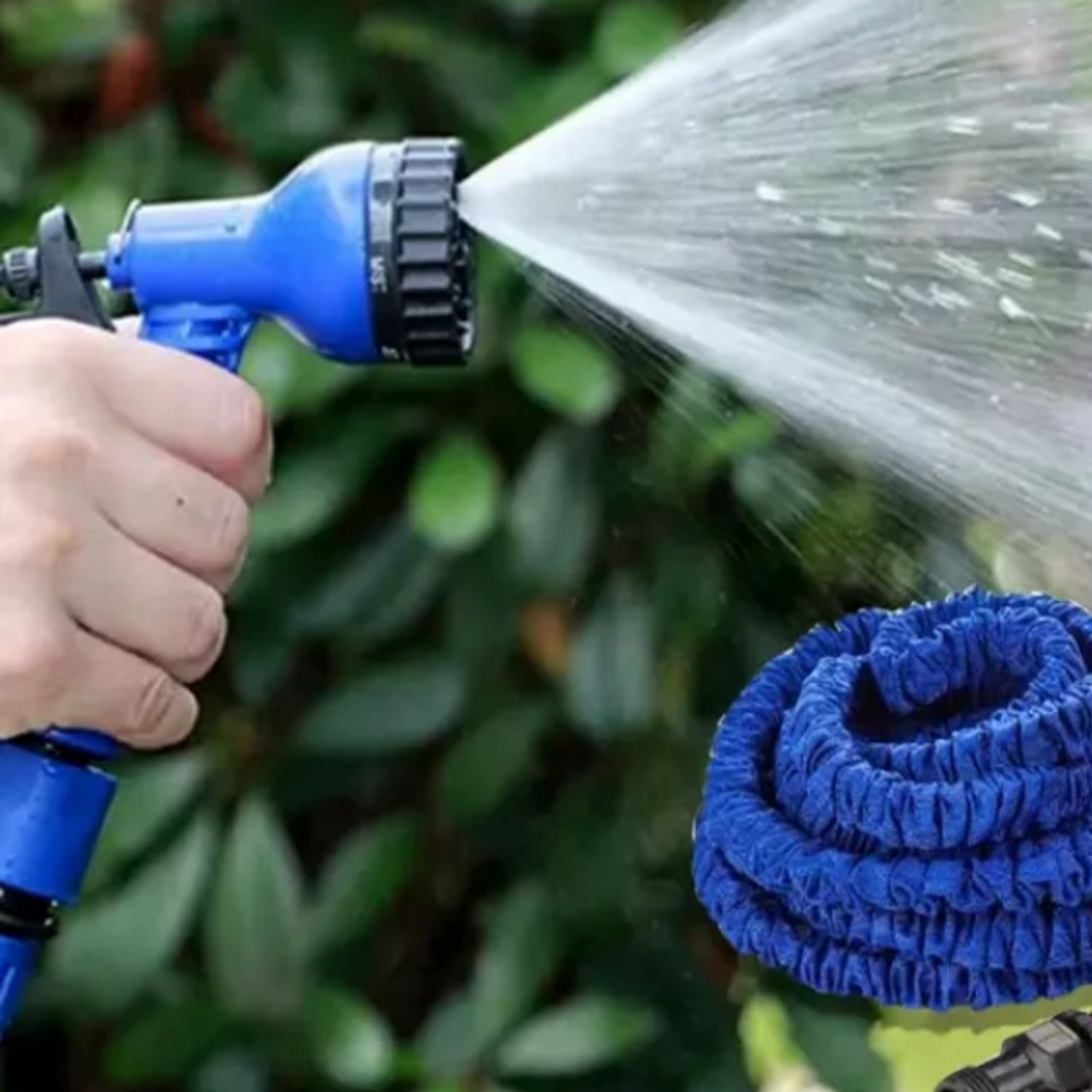 ForKumi 60m expandable garden hose in use with blue spray nozzle watering plants outdoors