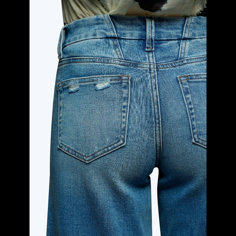 Close-up back view of Avis mid-low stretch jeans for women in distressed blue denim fabric