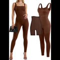 Avis brown tummy control jumpsuit with seamless design on model holding black clutch