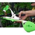ForKumi vine tying tool kit in use with green handle tying plant vines effectively