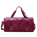 ForKumi maroon waterproof gym duffel bag with dual handles and front pockets