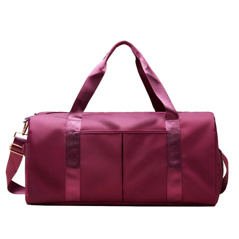 ForKumi maroon waterproof gym duffel bag with dual handles and front pockets