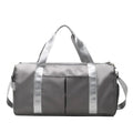 ForKumi waterproof gym duffel bag in gray with silver straps and multiple compartments