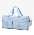 ForKumi light blue waterproof gym duffel bag with dual handles and adjustable shoulder strap