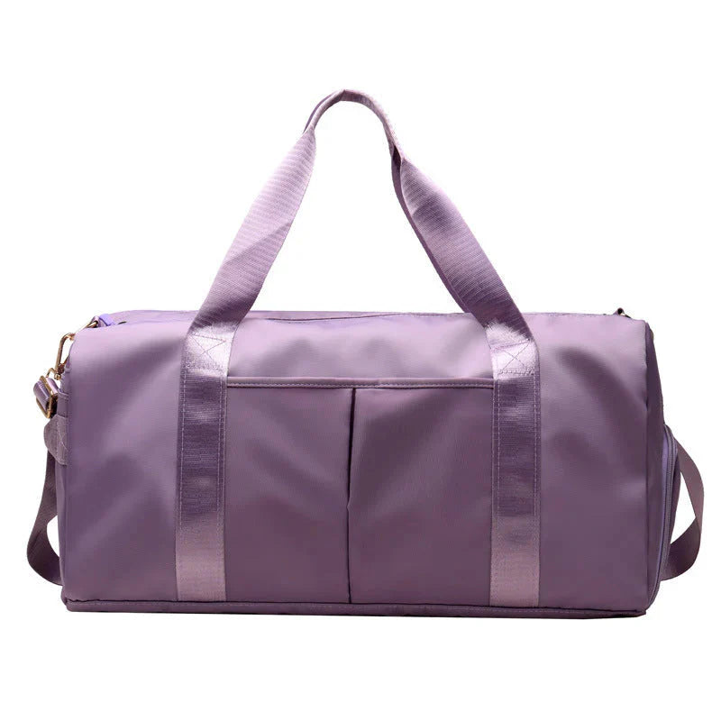 ForKumi waterproof gym duffel bag in purple with dual front pockets and sturdy handles