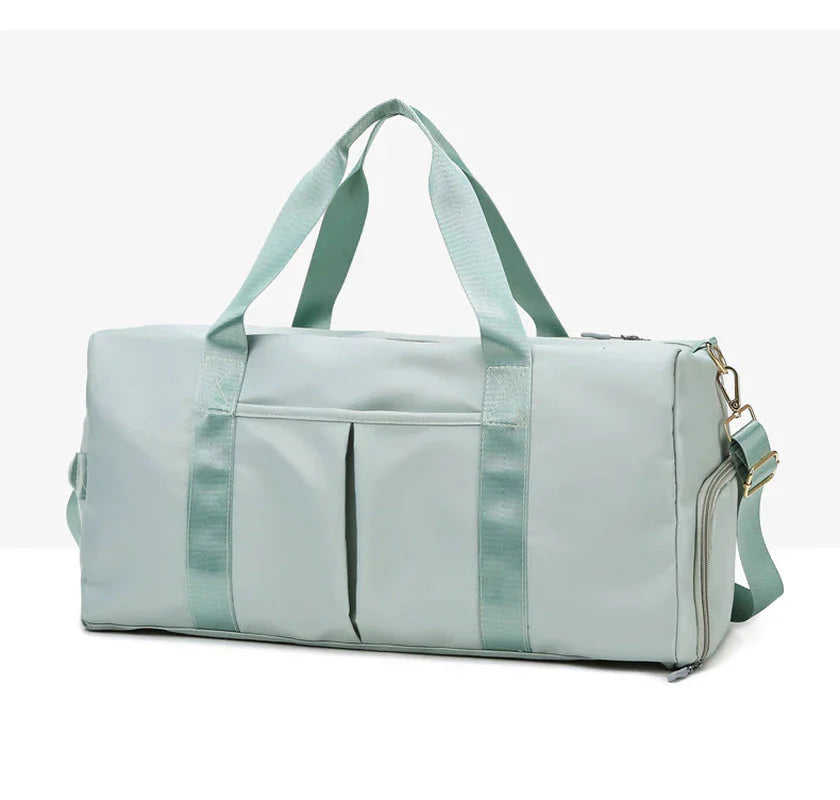 ForKumi waterproof gym duffel bag in light green with dual handles and adjustable shoulder strap