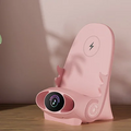 ForKumi 15W wireless charging phone holder in pink with digital series display on a wooden surface