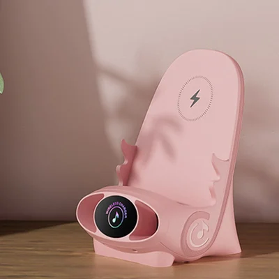ForKumi 15W wireless charging phone holder in pink with digital series display on a wooden surface