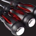 Close up of ForKumi multifunctional screwdriver set with ergonomic black and red handles for home use
